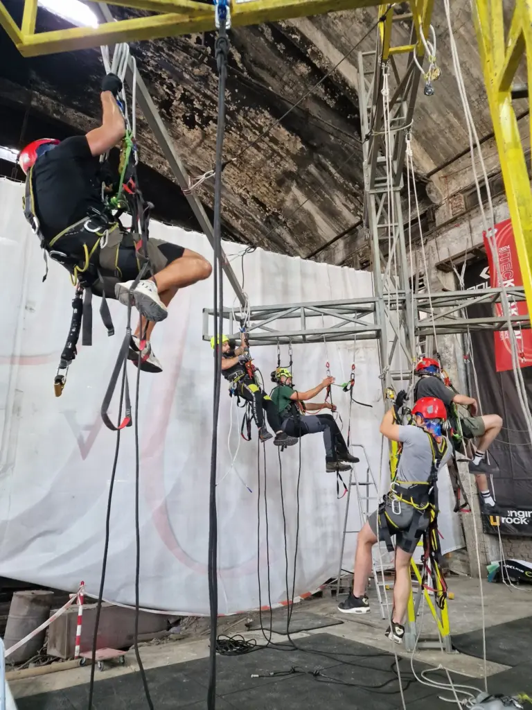 Trainees practising rope ascent and positioning techniques