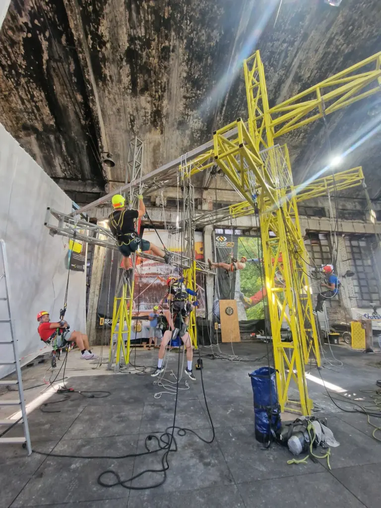 Several rope access trainees working around the central training structure at Profixt