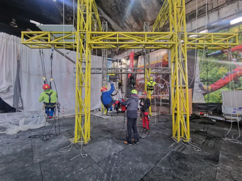 Rope access instructor demonstrating equipment to a trainee