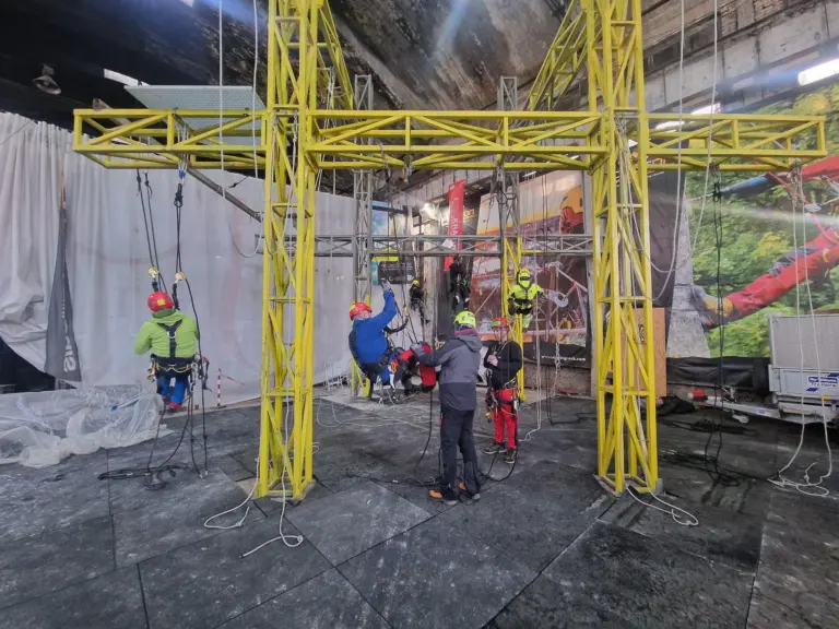 Rope access instructor demonstrating equipment to a trainee