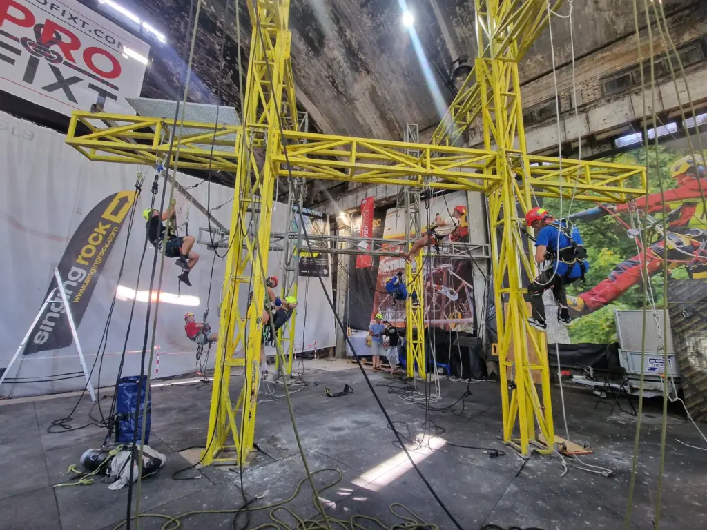 Rope access trainees exercising across the main yellow training structure